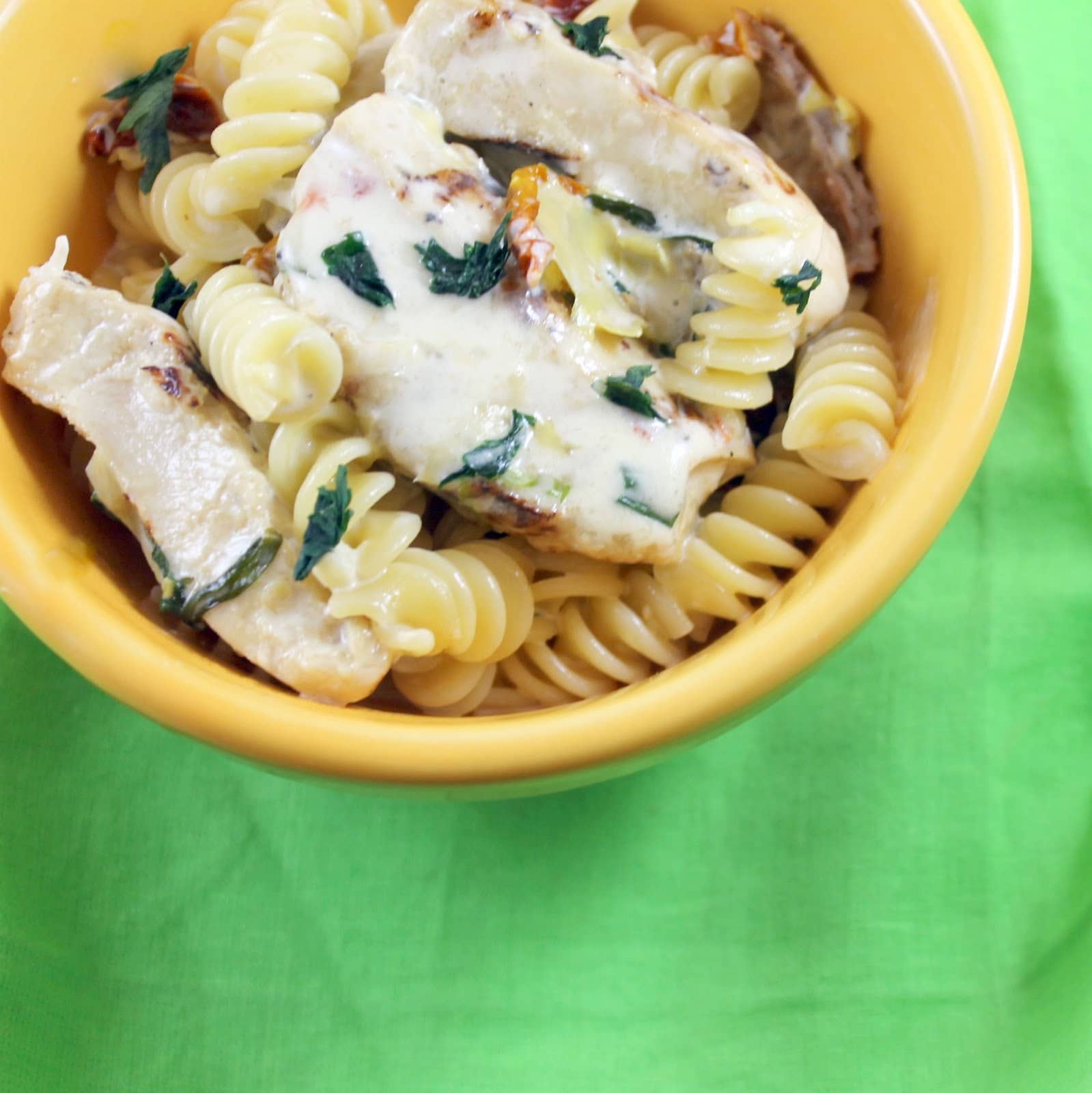 Lemon Pepper Chicken with Creamy Artichoke & Sun Dried Tomato Pasta