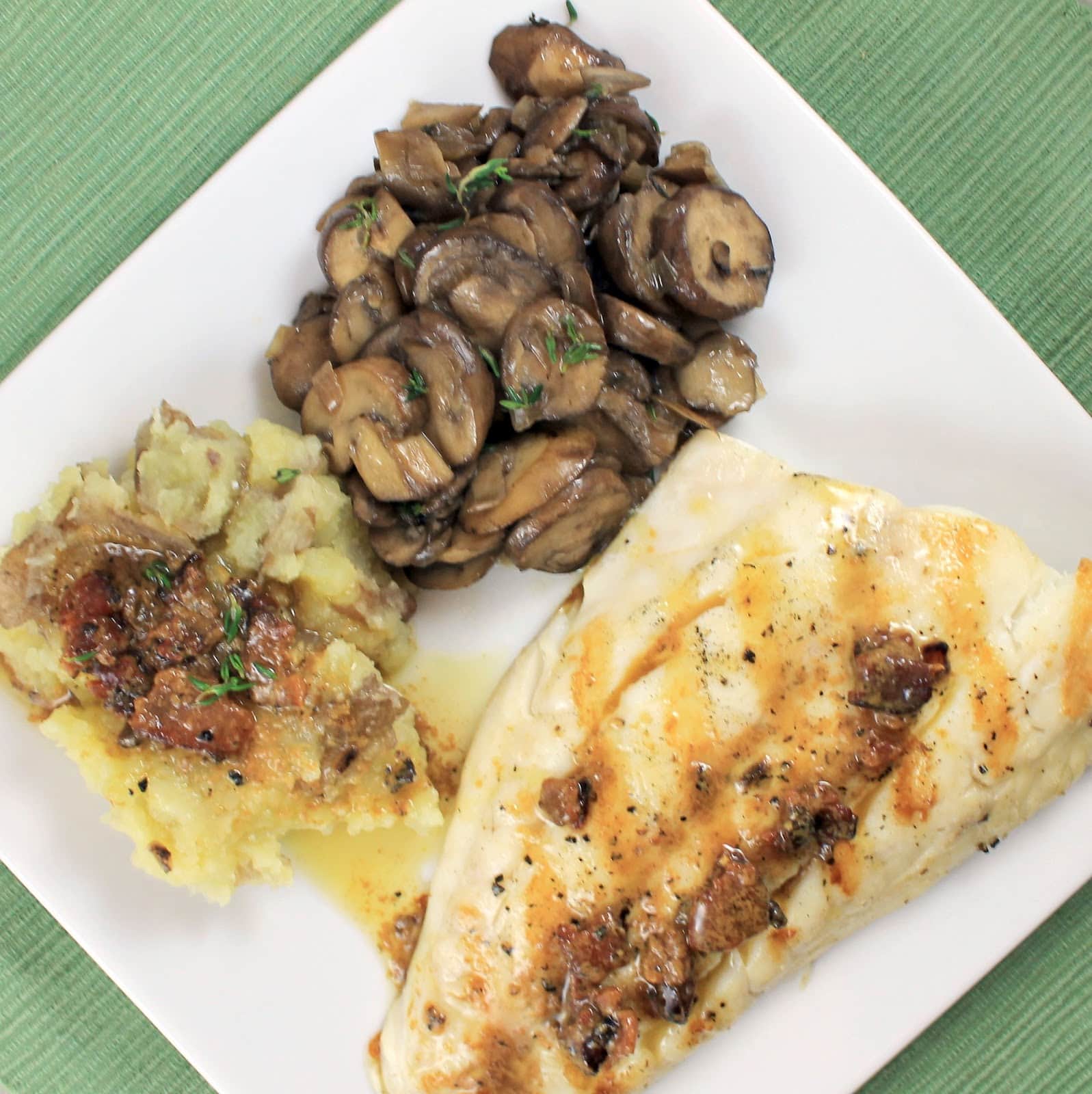 Grilled Striped Bass with Bacon Vinaigrette Red Smashed Potatoes and Sauteed Butter Thyme Mushrooms